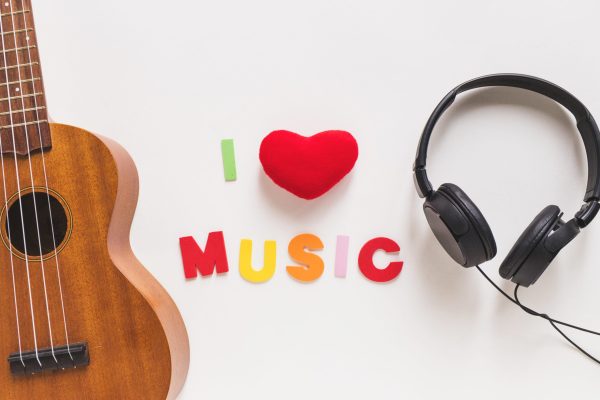 love-music-text-musical-guitar-headphone-white-background